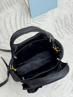 Prada black nylon mini bag open top with internal lining and gold hardware
