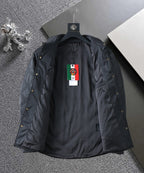 Quilted jacket front view, black with label tag and buttoned placket