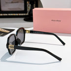 Square black acetate sunglasses, side view, with gold logo on temple