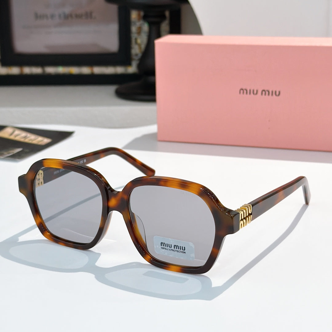 Square tortoiseshell acetate sunglasses with pale blue lenses and gold logo detailing