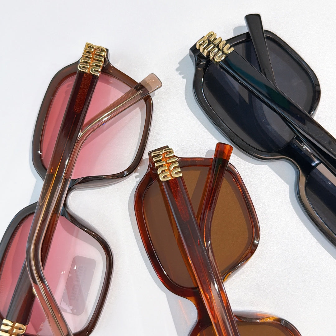 Assorted oversized sunglasses with brown, pink, and black frames and tinted lenses