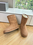 Tan suede mid-calf pull-on boots with fur collar, side-by-side