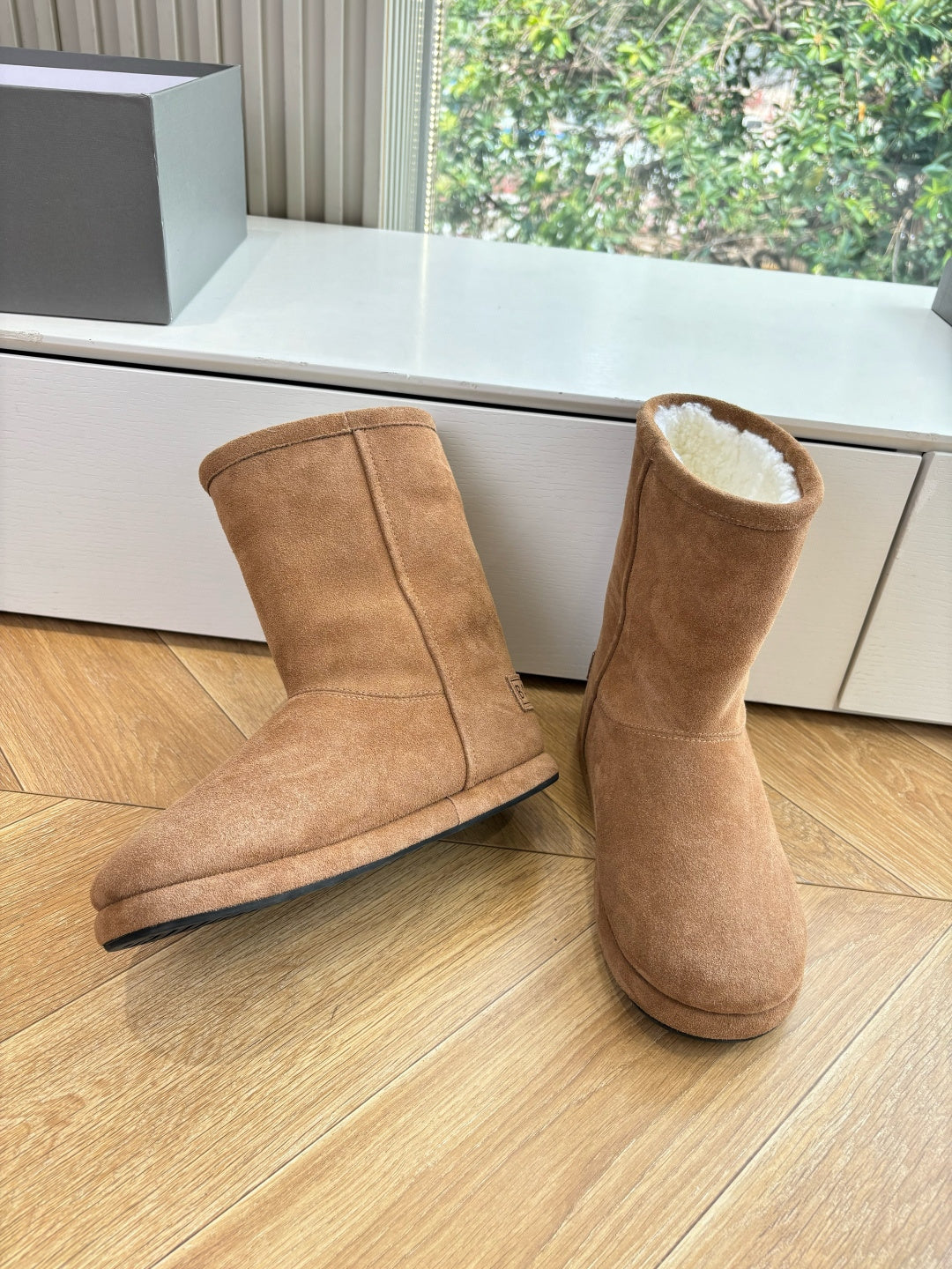Tan suede mid-calf pull-on boots with fur collar, side-by-side