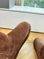 Balenciaga suede mid-calf boots, close view of rounded toe and stitching