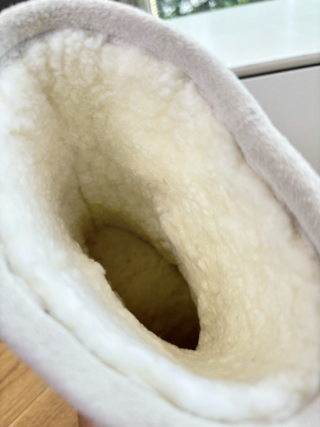 Balenciaga ladies boot lining close-up, fluffy interior in light beige