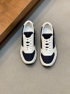 White and navy unisex lace-up sneakers with rubber sole and side panel accents