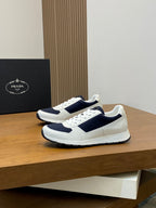 White and navy unisex lace-up sneakers with strap-style side panel and rubber sole