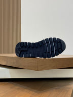 Navy unisex sneaker outsole with deep rubber tread and traction pattern
