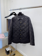 Versace quilted jacket with dark button front and raised diamond stitching