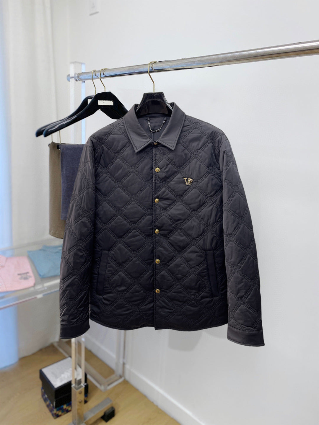 Versace quilted jacket with dark button front and raised diamond stitching