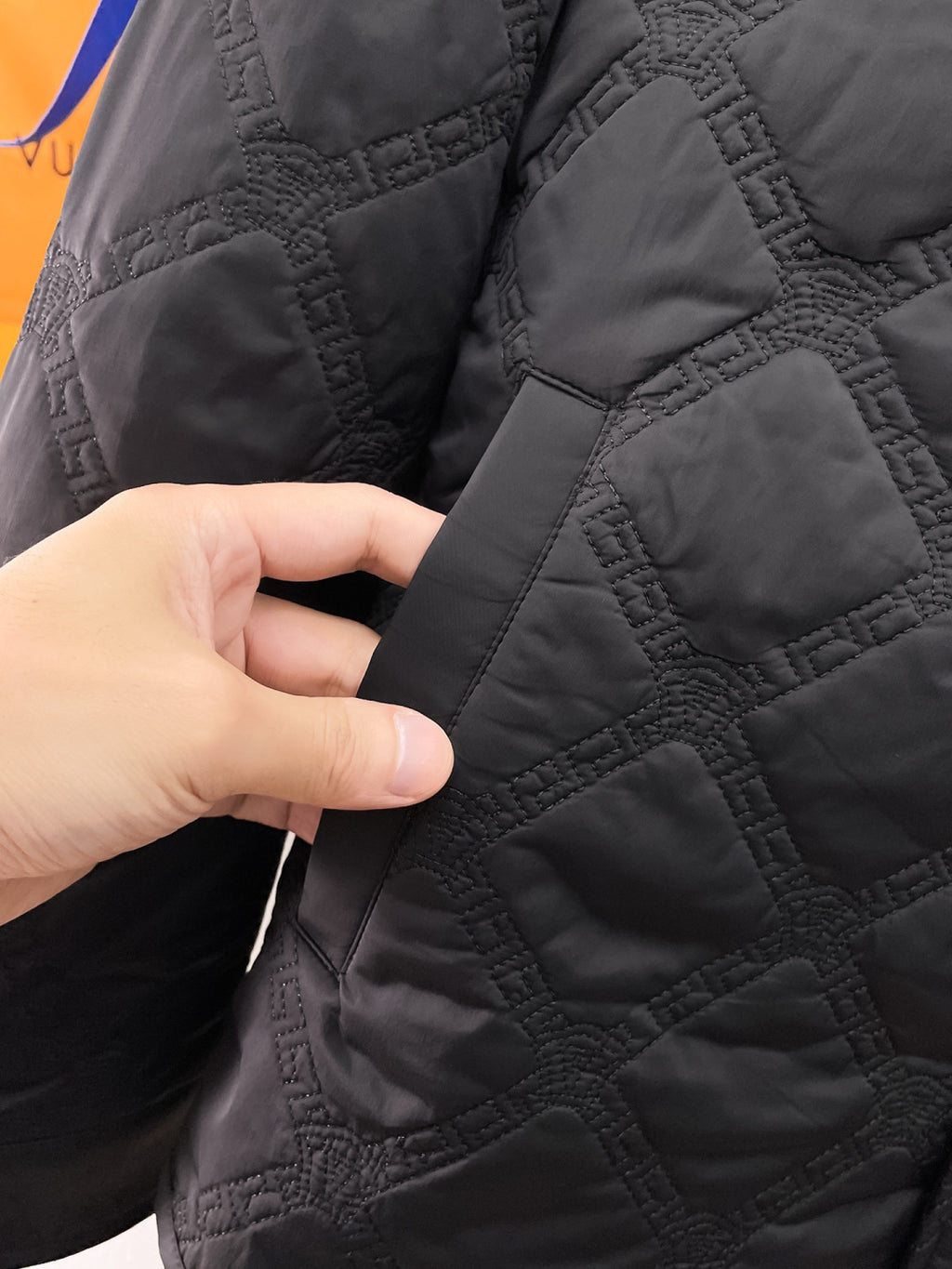 Versace quilted jacket cuff detail with welt pocket and snap button