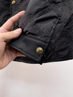 Versace quilted jacket hem detail with gold snap button and diamond quilting