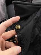 Versace quilted jacket sleeve cuff with gold snap and textured panel