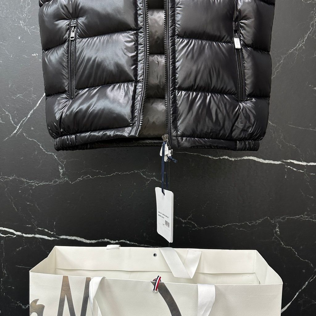 Moncler long puffer vest, black, front panel stitching with hanging size tag