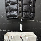 Moncler long puffer vest, black, front panel stitching with hanging size tag