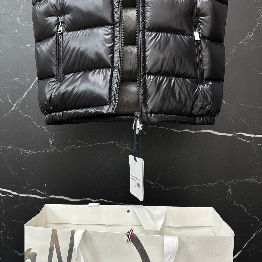Moncler long puffer vest, black, front panel stitching with hanging size tag