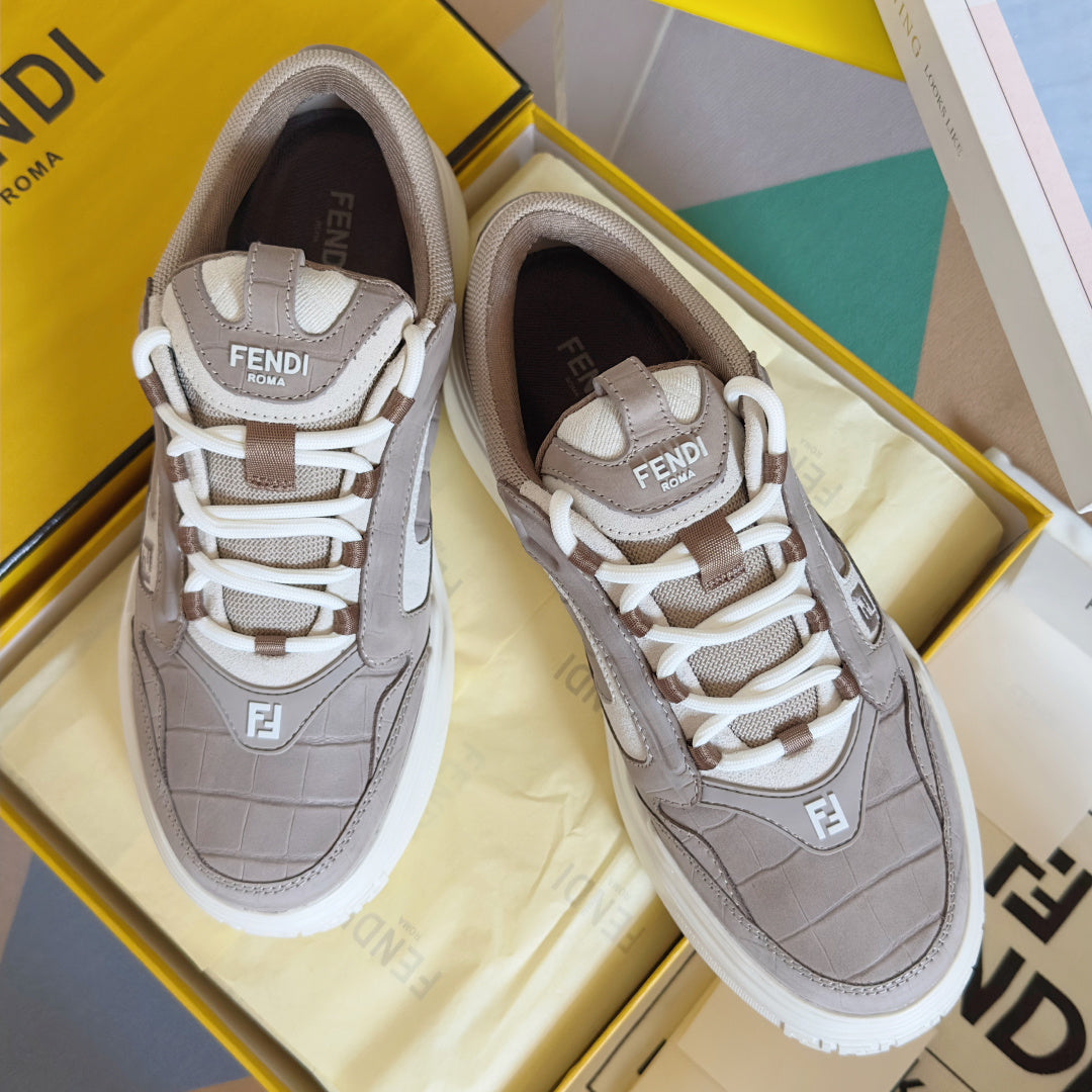 Taupe and white Fendi low-top sneakers with white laces and chunky sole