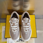 Taupe Fendi low-top sneakers pair, front view with white laces and Fendi badges