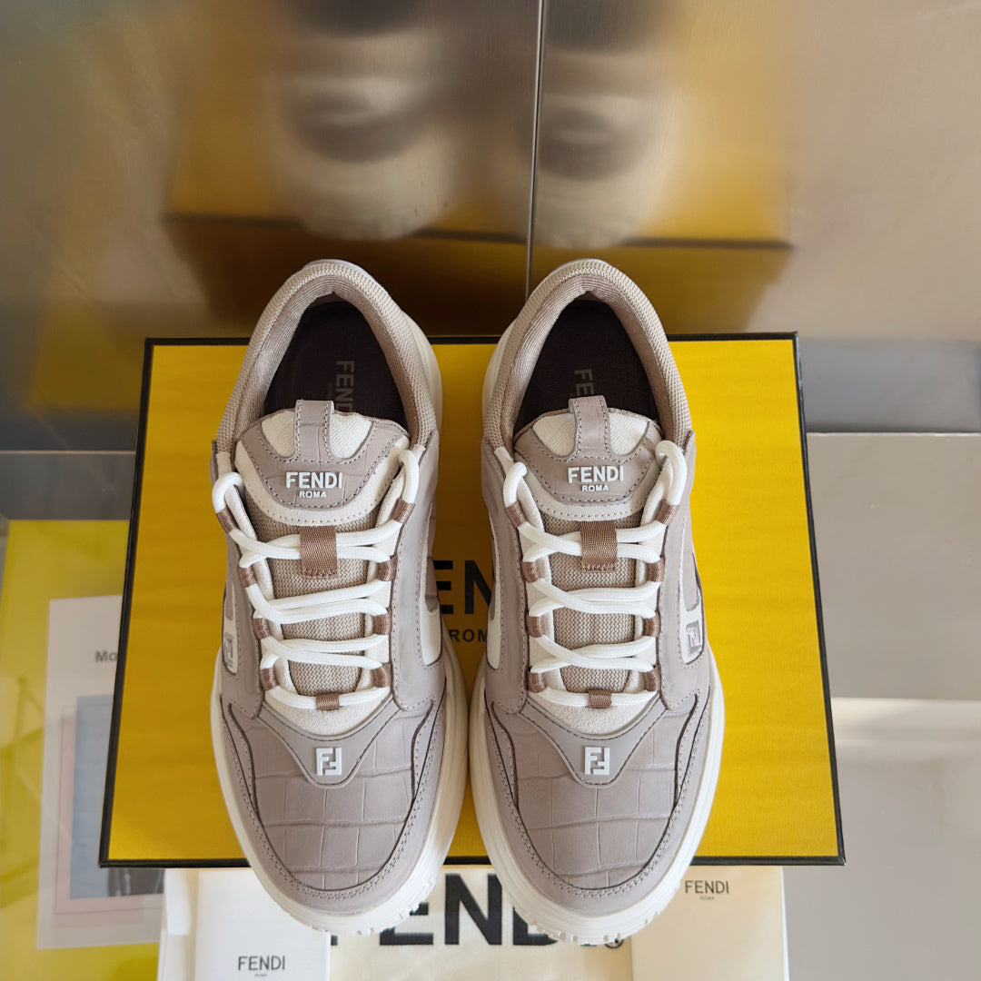 Taupe Fendi low-top sneakers pair, front view with white laces and Fendi badges