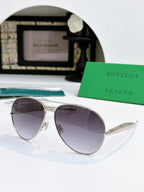 Bottega Veneta sunglasses with silver frame and smoky violet tinted lenses