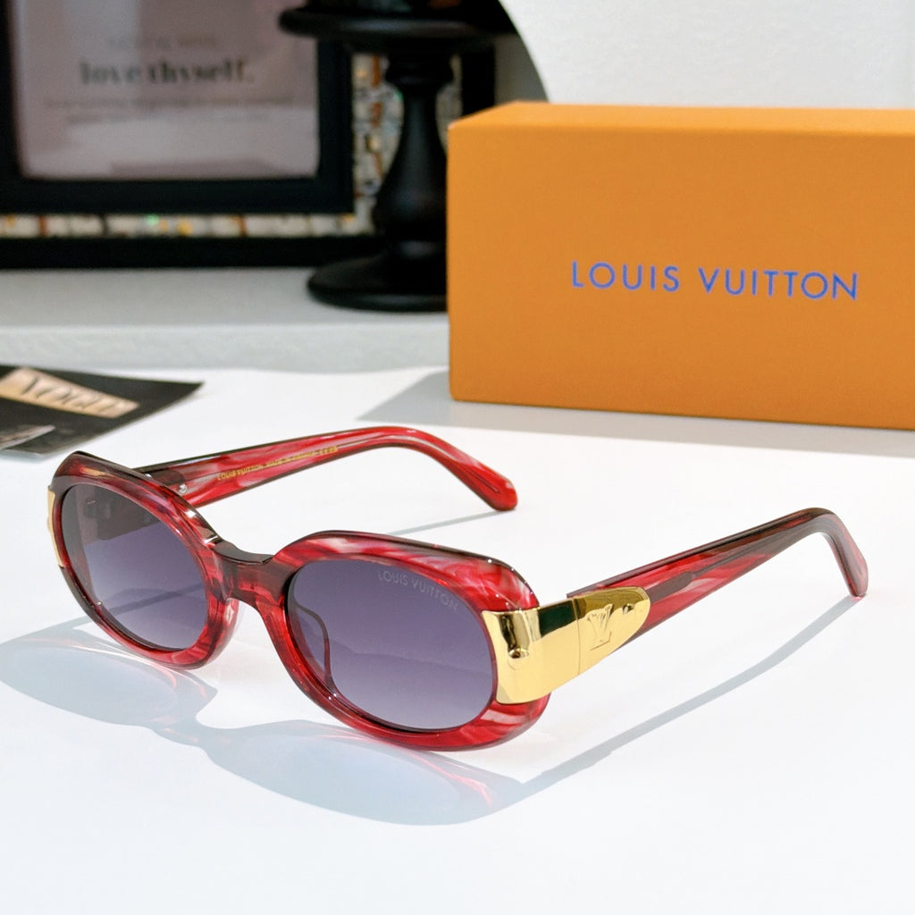 Sunglasses with red frames and gold-tone logo bridge, purple-tinted lenses