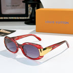 Sunglasses with red frames and gold-tone logo bridge, purple-tinted lenses