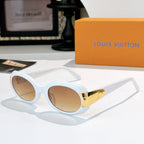 Sunglasses with white frames and gold-tone logo bridge, tan tinted lenses