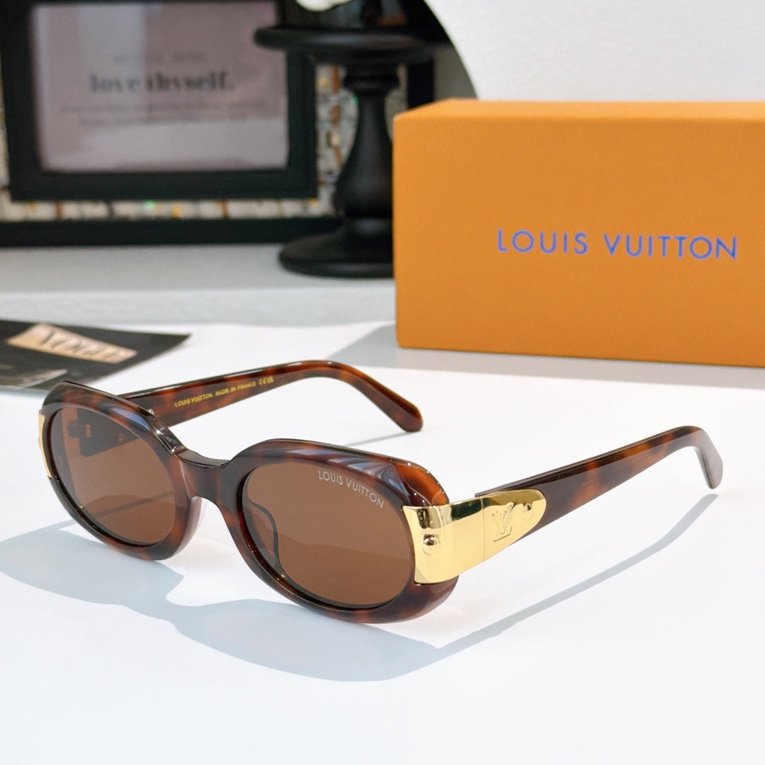Sunglasses with brown tortoise frames and gold-tone logo bridge, tinted lenses