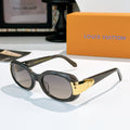 Louis Vuitton sunglasses with black frames and gold-tone logo temple detail