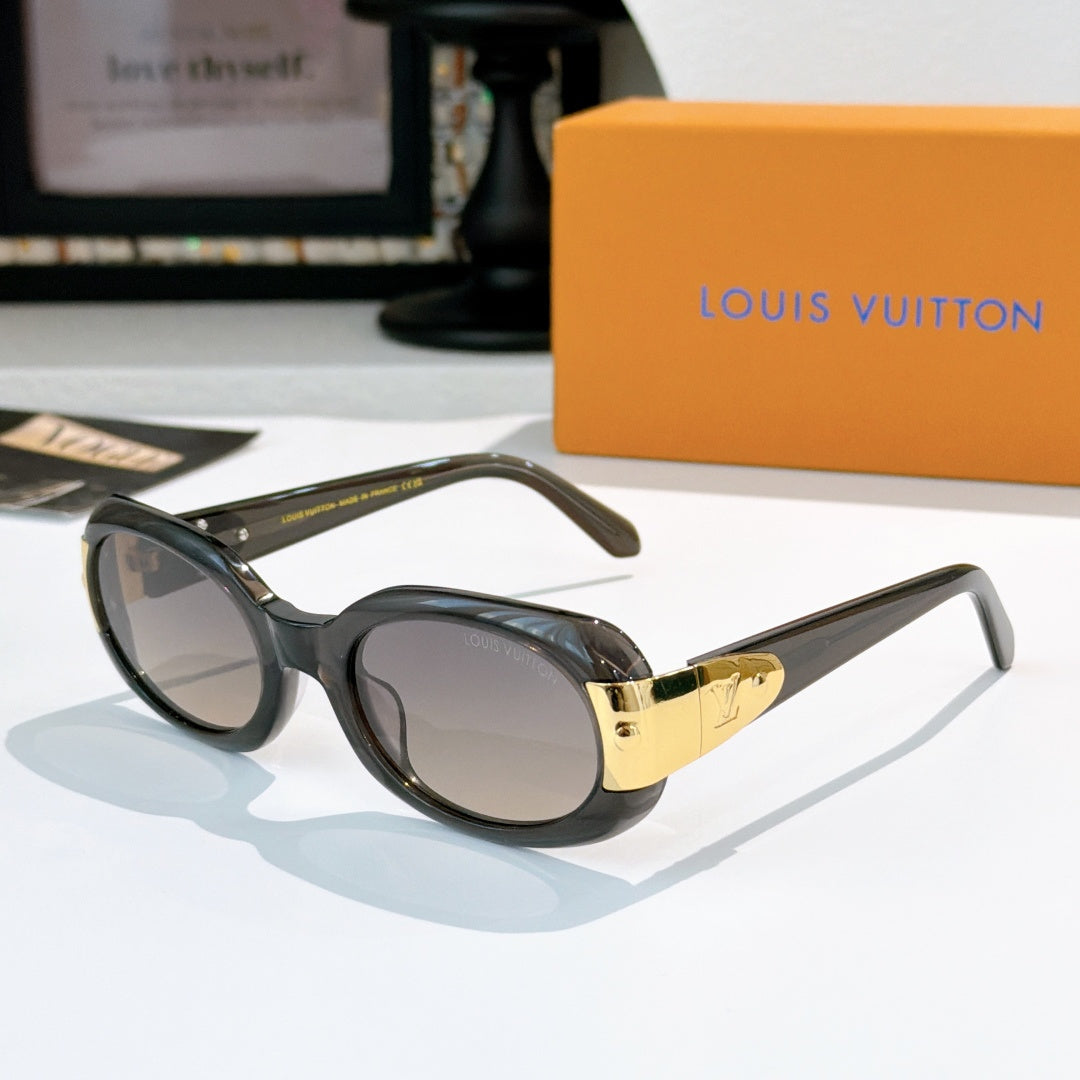 Louis Vuitton sunglasses with black frames and gold-tone logo temple detail