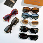 Sunglasses assortment: red, blue, white, black frames with gold-tone logo accents