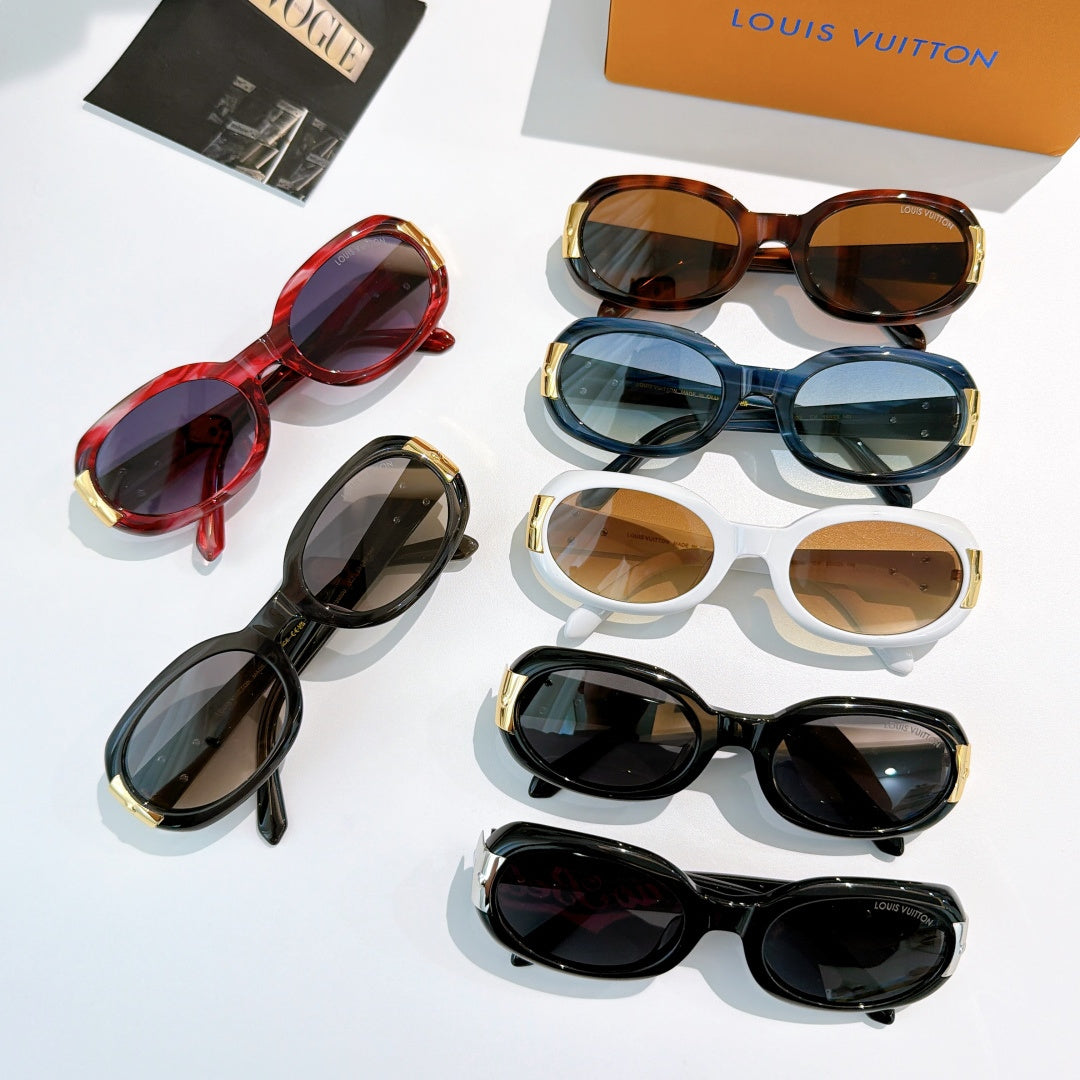 Sunglasses assortment: red, blue, white, black frames with gold-tone logo accents