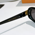 Louis Vuitton sunglasses temple close-up with printed numbers on black frame