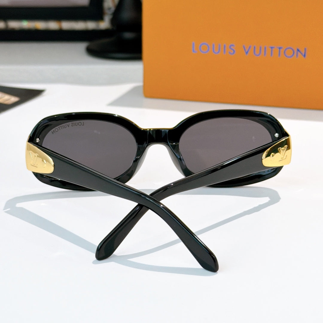 Louis Vuitton sunglasses front view, black cat-eye frames with gold accents