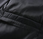 Black jacket lining close-up with horizontal seam and smooth fabric panel