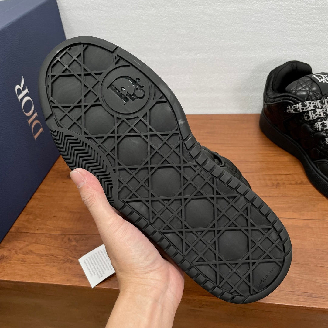 Black sneaker outsole with geometric tread pattern