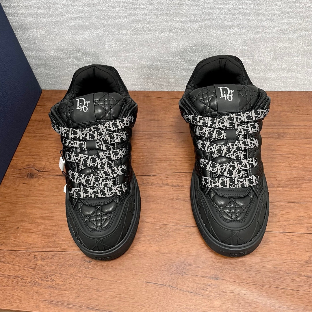 Black quilted sneakers with logo-print heel tabs and padded collar, lace-up