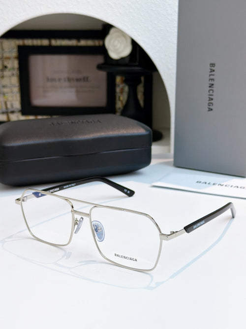 Silver metal eyeglasses with clear lenses and black temple text.