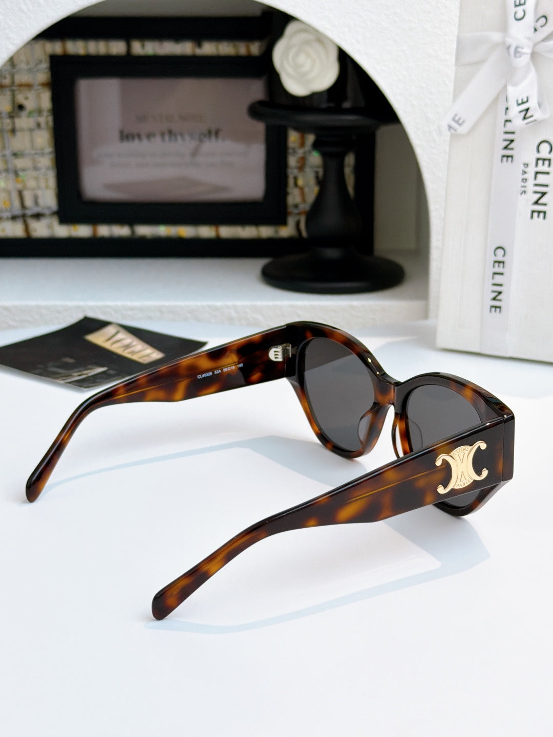 Celine cat-eye sunglasses with tortoiseshell frame and dark lenses, side profile