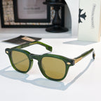 Green sunglasses with olive-tinted lenses and gold logo accents.