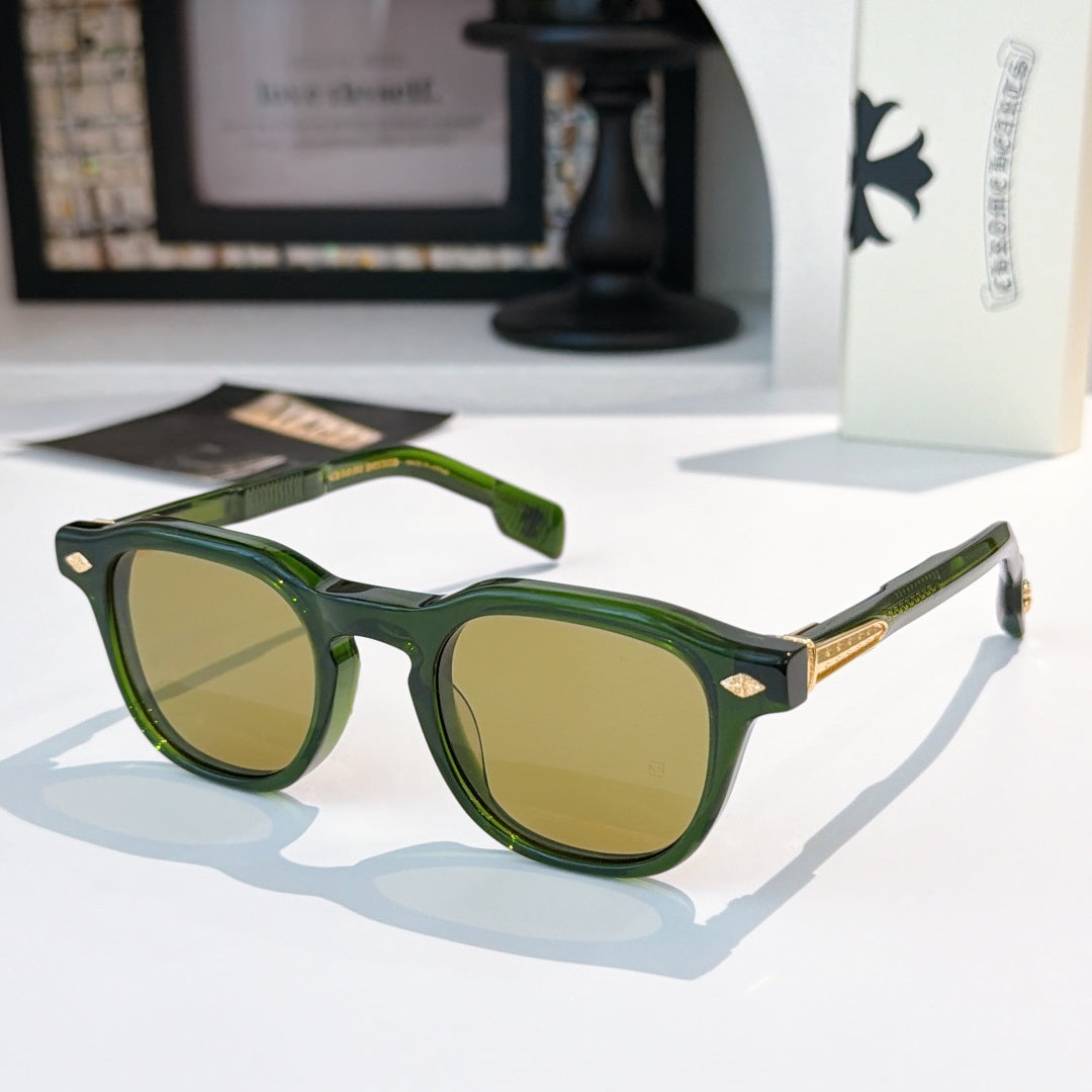 Green sunglasses with olive-tinted lenses and gold logo accents.