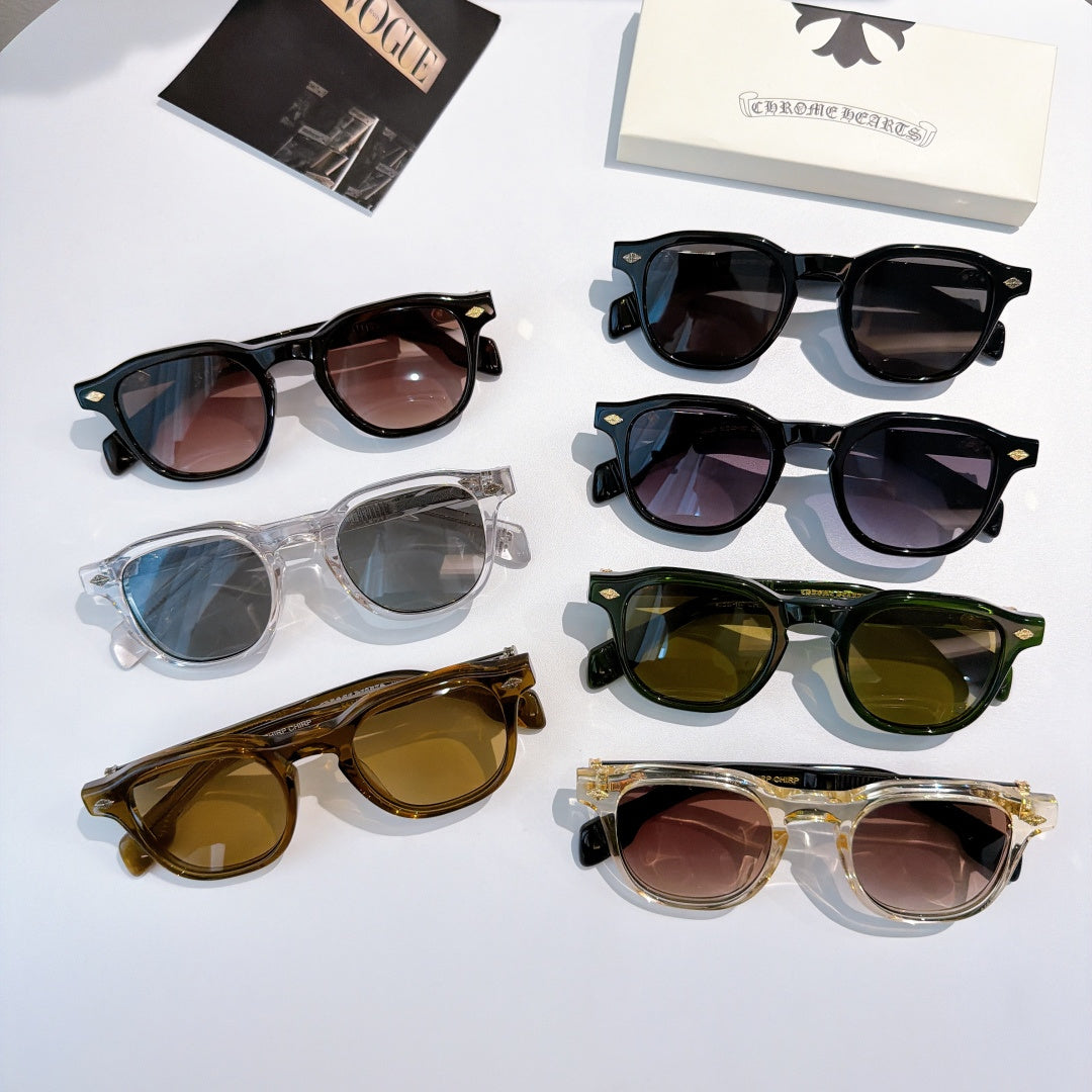 Assorted sunglasses with black, clear, green, and brown frames laid flat.
