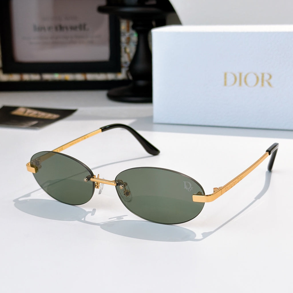 Dior sunglasses with gold-tone frame and green oval lenses with orange accents