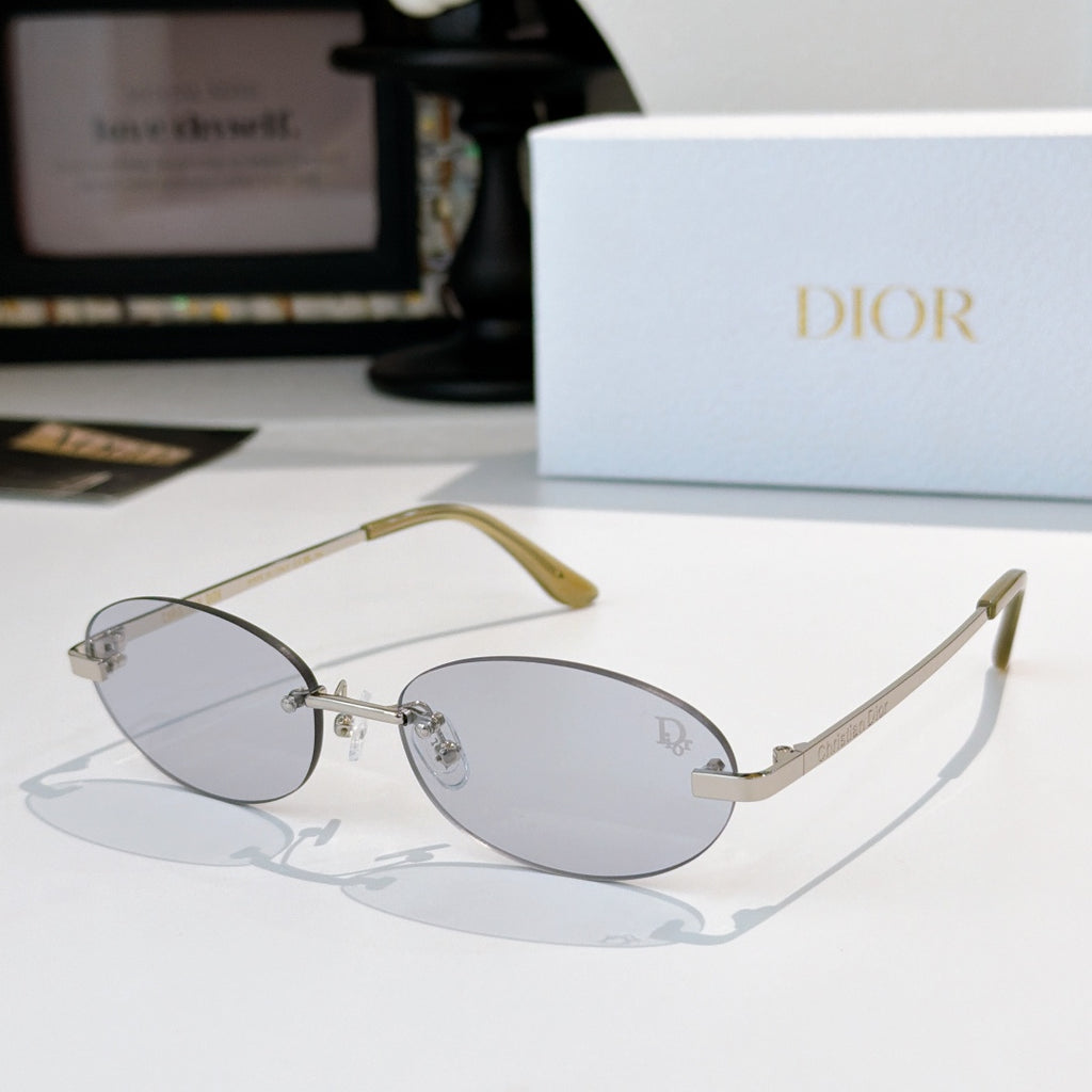 Dior sunglasses with thin metal frame and light gray oval lenses