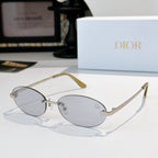 Dior sunglasses with thin metal frame and light gray oval lenses