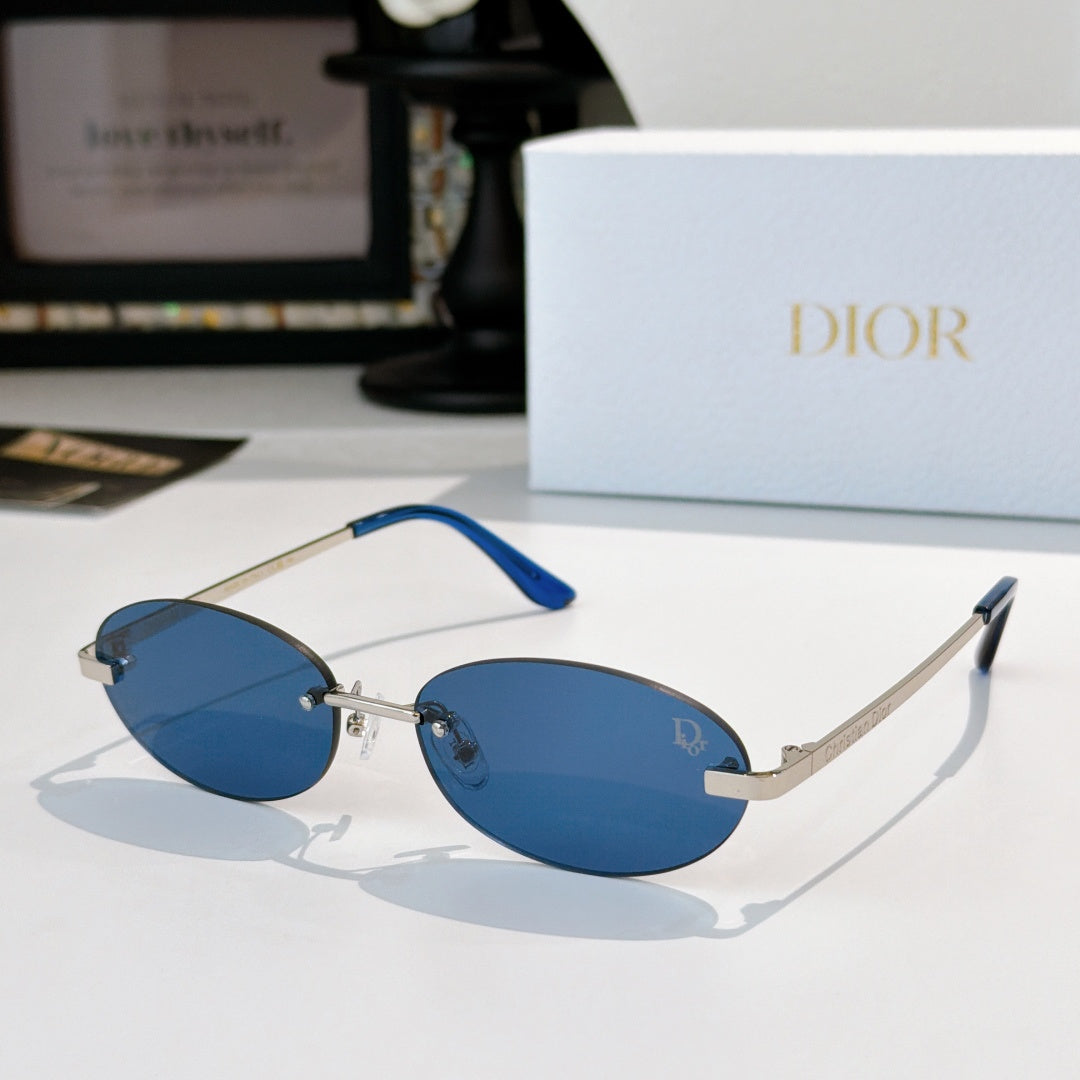 Dior sunglasses with gold-tone frame, blue oval lenses, and blue temple tips