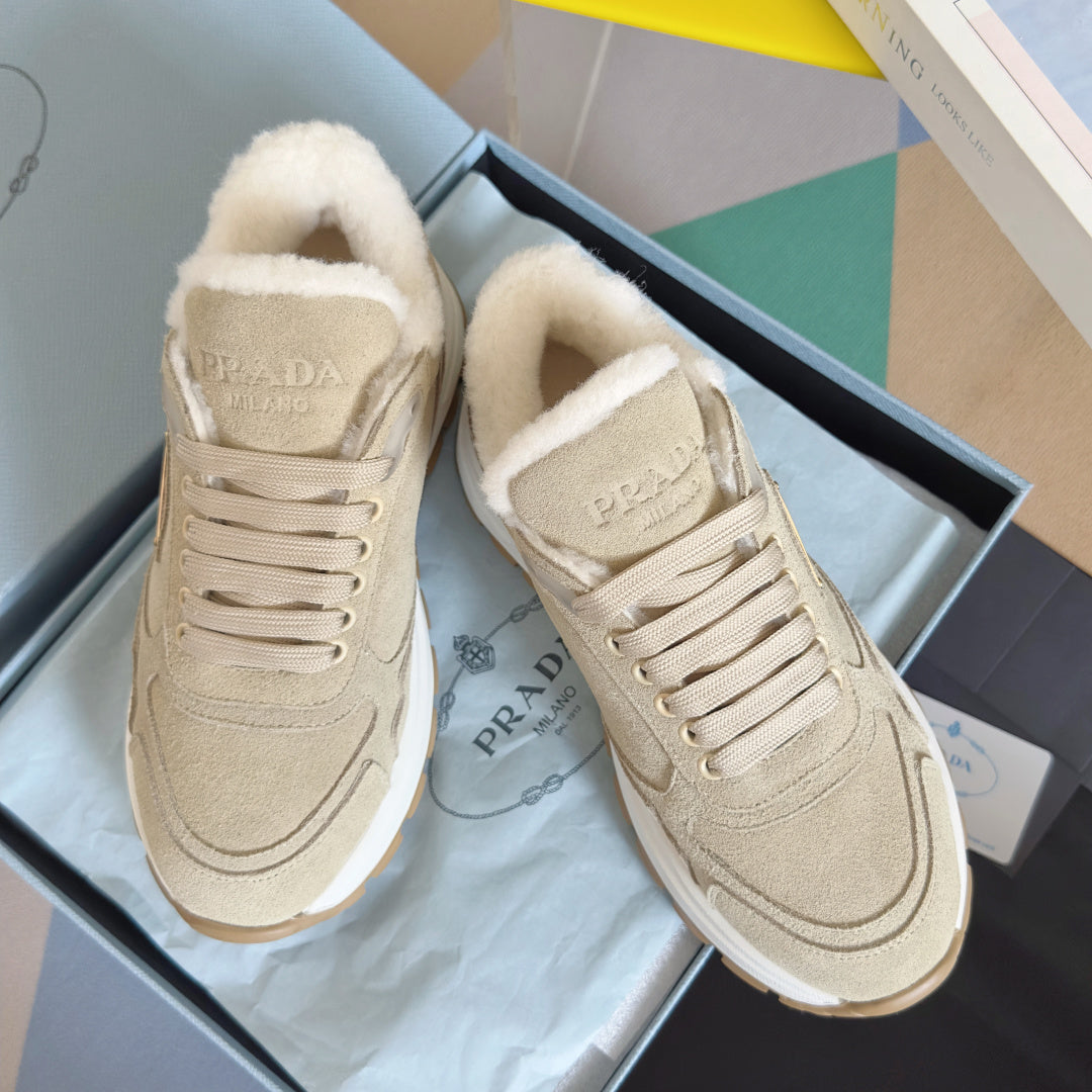 Prada unisex suede sneaker with white faux-fur lining and lace-up front