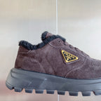 Prada suede sneaker with logo patch and lug sole, brown, side close-up