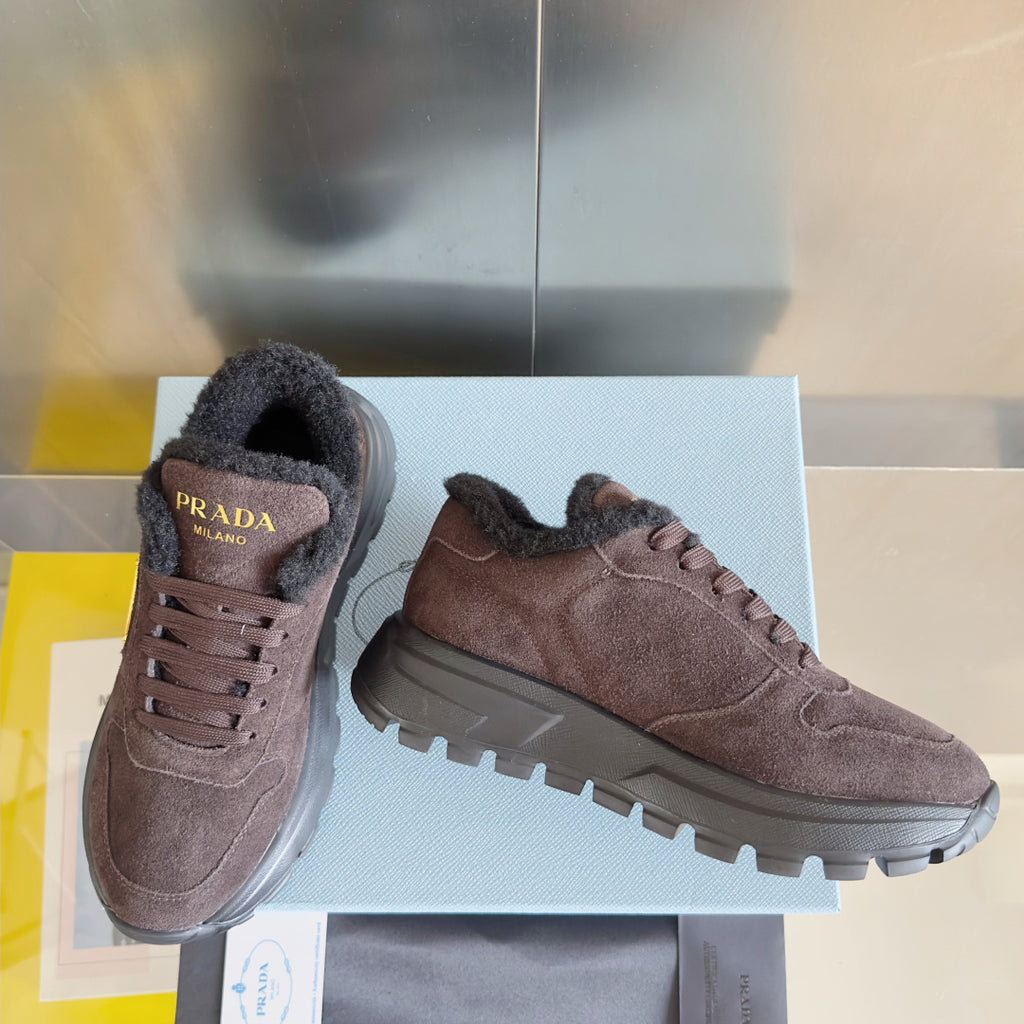 Prada suede sneakers with lace-up closure and lug sole, brown, angled view