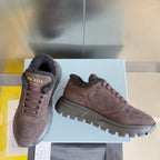 Prada suede sneakers with lace-up closure and lug sole, brown, angled view